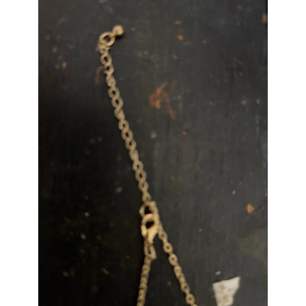 Gold Tone Leaf Charm Long Necklace with Pink Marbled Stone and Terracotta Tassel